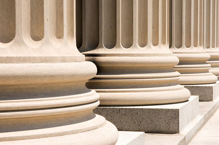 series of column bases sitting on marble plinth