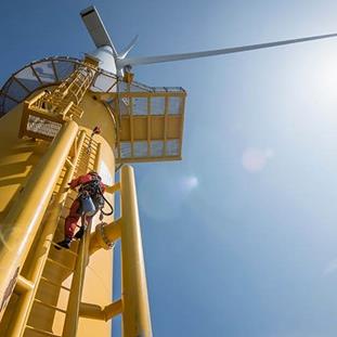 Windmill with person climbing up the ladder