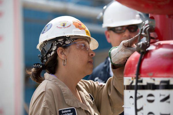 Employees working on cannister