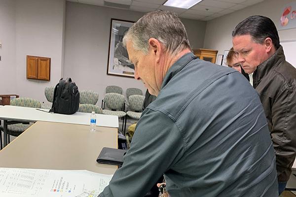Men looking over plans