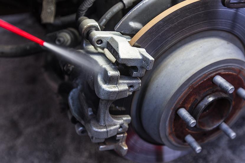 spraying car brake pad and disc with caliper 1 3 1