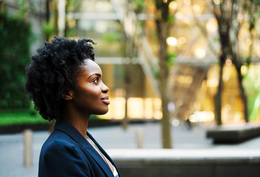 An image of a young woman looking up.