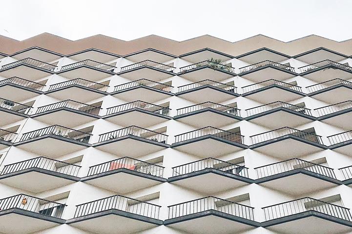 front facade of apartment building with balconies